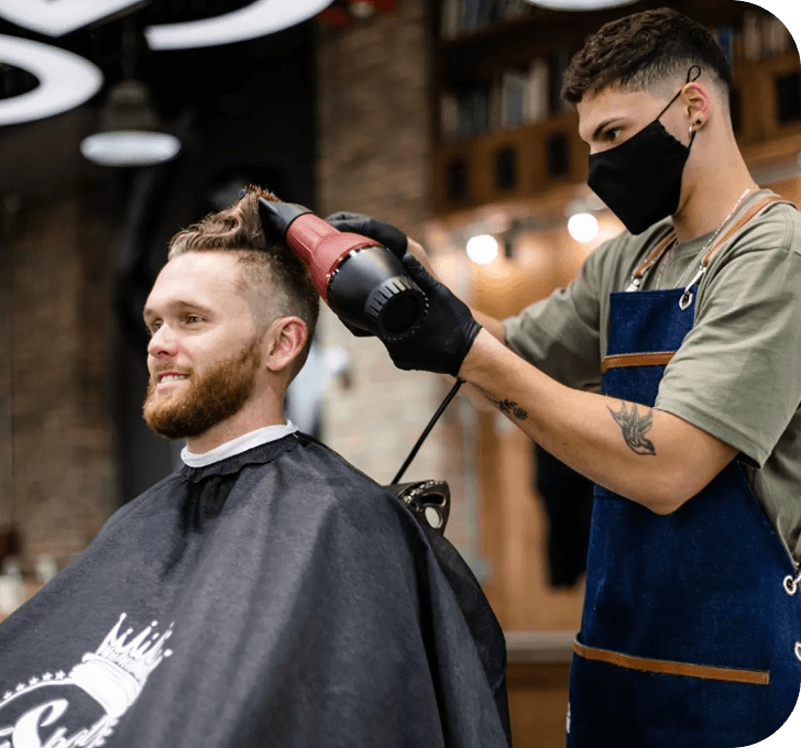 Professional barber styling a client